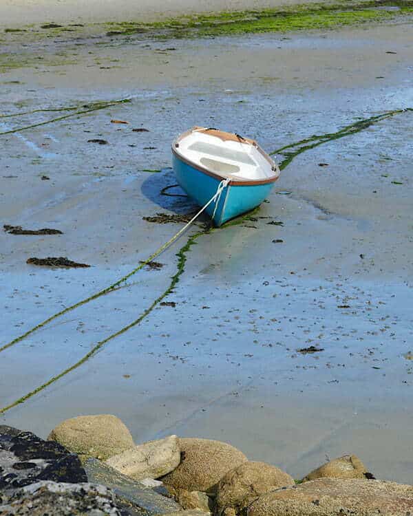 Close Up Of A Small Fishing Boat. Reflection On The Sea Water Of A